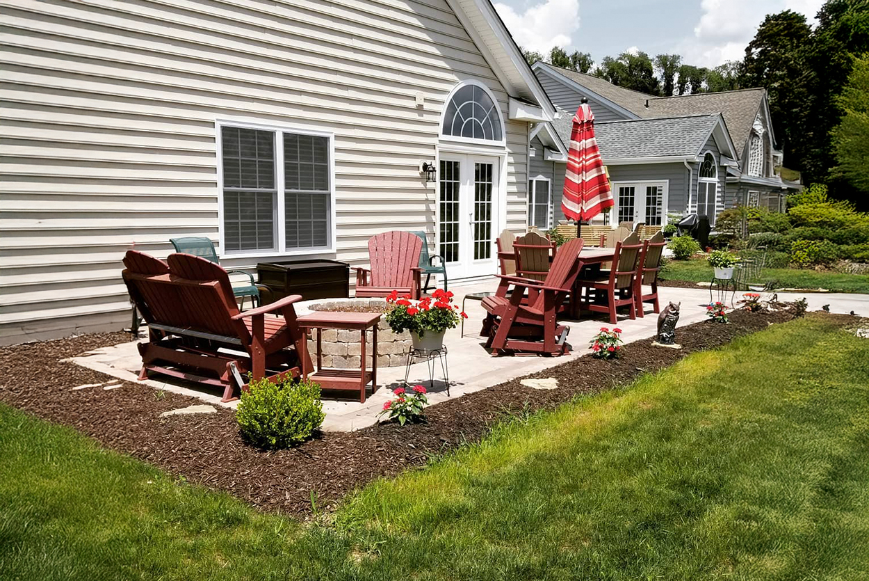 Cozy patio with seating and flowers